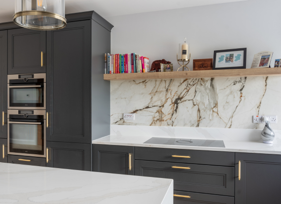 1._A Statement Island with Layered Stone Surfaces Quartz Calacatta Gold with Bevel Edge